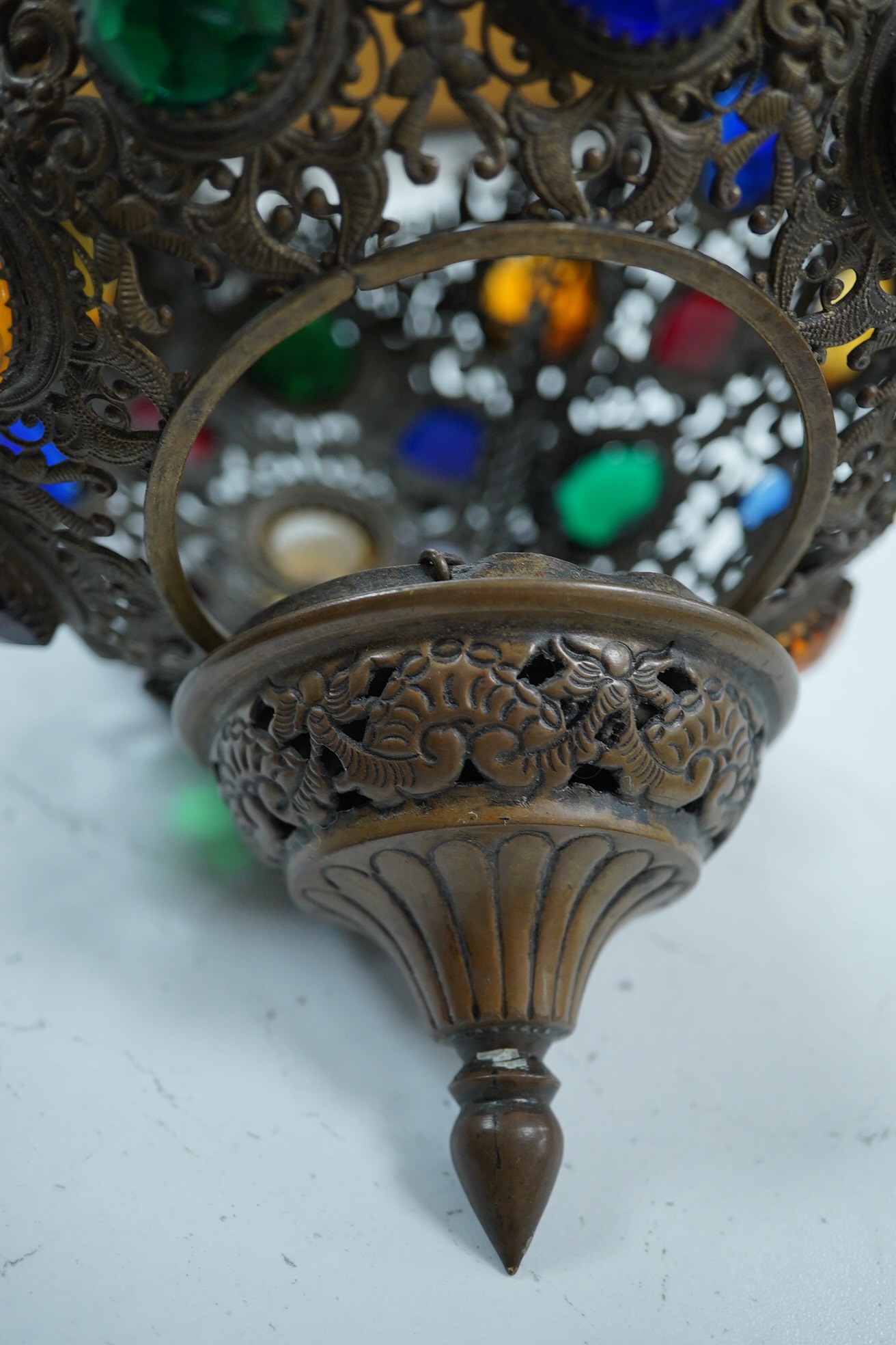 An Edwardian gilt metal light pendant set with facetted coloured glass prisms, 18cm high. Condition - fair to good